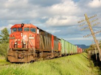 Departing Thunder Bay with the Norwester Mountains as the backdrop, CN A437 enters the OCS at SNS Evans with a pair of cowl units in the form of C40-8M 2409 and an unidentified SD60F trailing. Something off about this edition of this train is the lack of grain empties- likely due to the mid week Canada Day holiday- the train is mostly comprised of boxcar loads of paper from the local Abitibi-Bowater paper mill accompanied by residue tank cars from "Petro-Canada". 