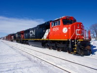 Freshly rebuilt CN 8324 leads CN 368 through Dorval, with CN 3018 trailing.