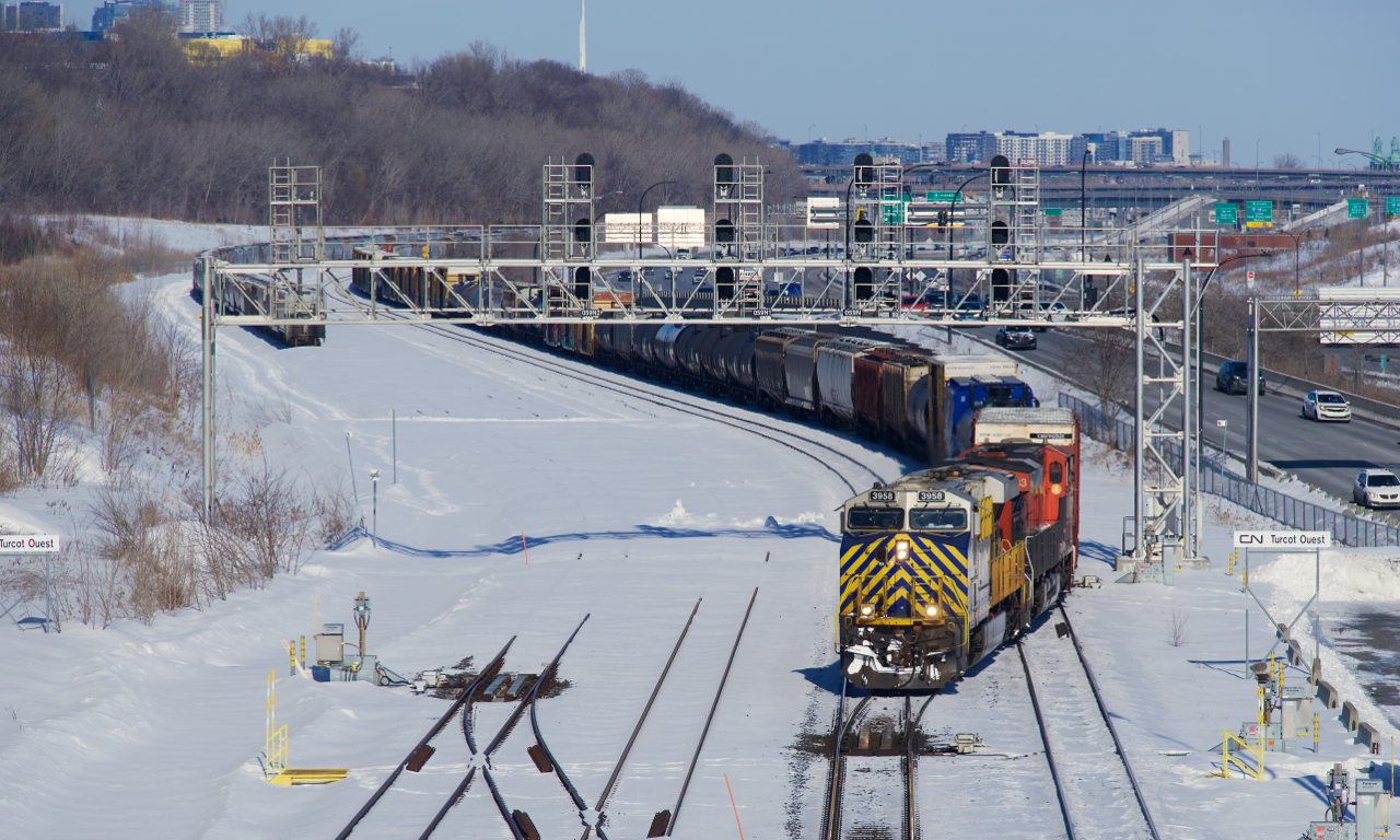 CN 527 is crossing over at Turcot Ouest with an ex-CREX leader.