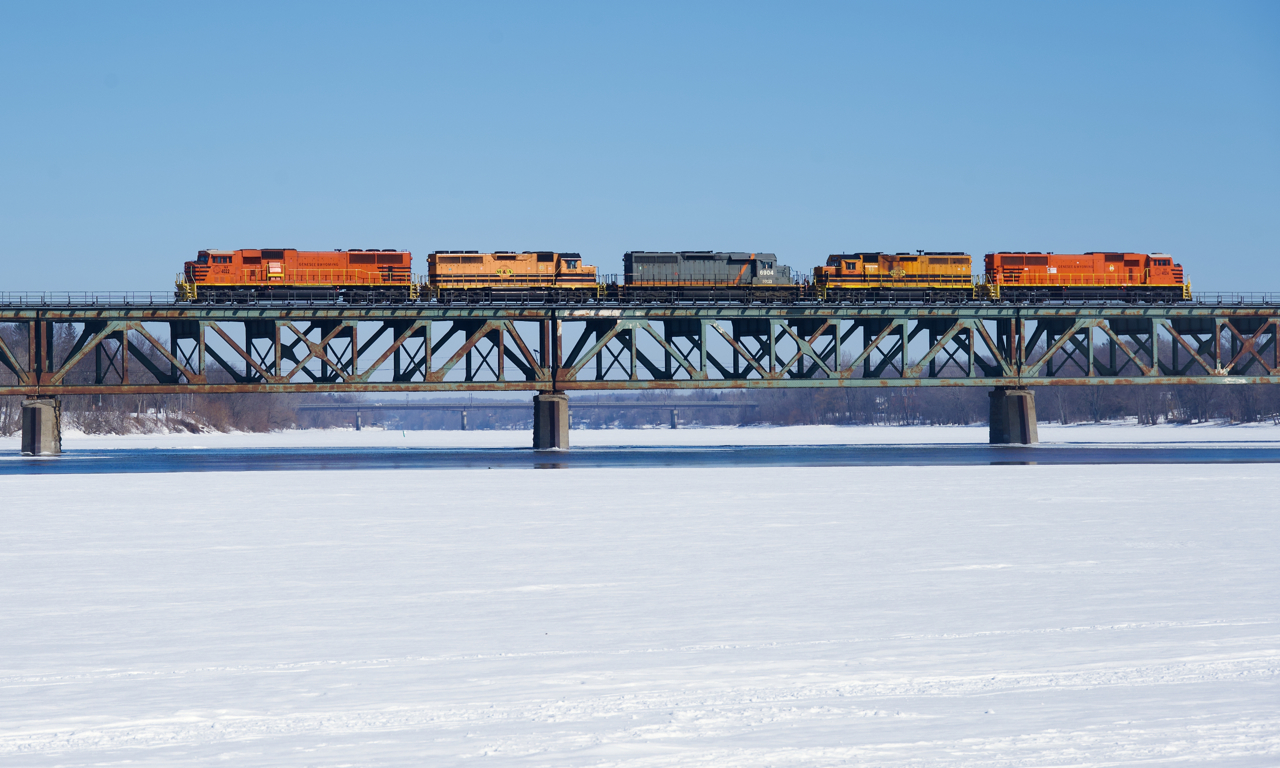 With CN refusing to take any cars from the St. Lawrence & Atlantic, SLR 520 is heading to Southwark Yard light power as it crosses the Richelieu River. Full consist: SLR 4022, SLR 3007, QGRY 6904, SLR 3047 & SLR 4024.