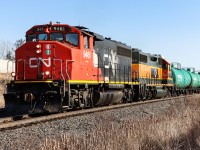 L551 is on the move eastward after waiting for another eastbound to clear Tansley. I believe the tanks are for RECOCHEM Inc. in Milton. The trailing unit is a former BNSF unit now stenciled CN 4959, noticeably missing identifying numbers on the side of the cab.