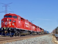 After suffering mechanical issues and stalling at Meadowvale, a pair of SD40’s were sent to give the train a push, with that unsuccessful the power tacks onto the head end making a nice lash up as the train heads west at Lisgar. 