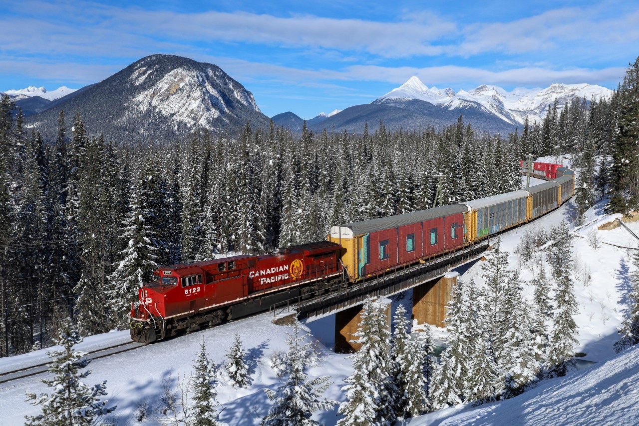 CPKC 113-20 crosses the Ottertail River, near the start of their journey between Field and Revelstoke on the aptly named Mountain Sub.