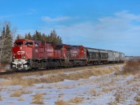 CPKC 303-616 grinds upgrade towards Olds, Alberta with CP 7035 leading. 