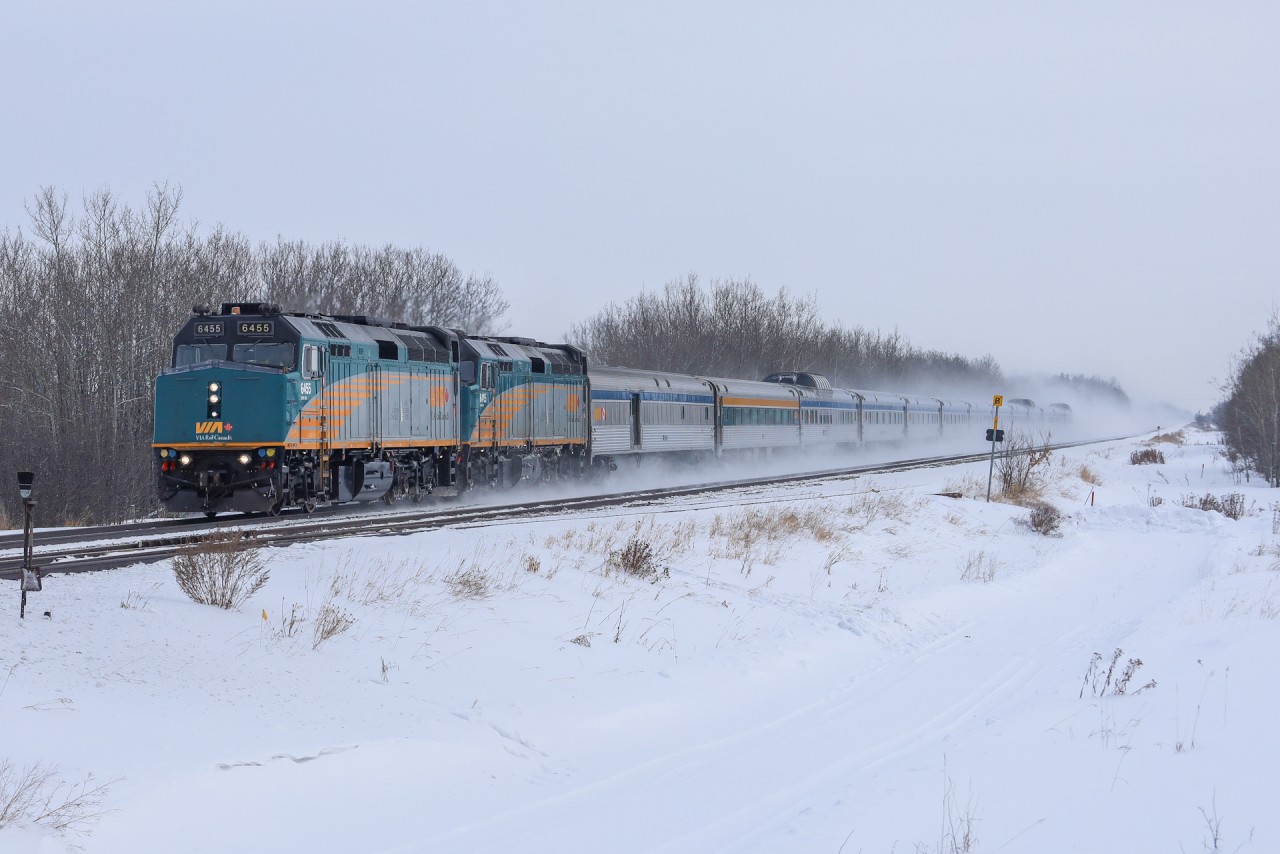 An 11 hour late VIA No. 1, The Candian blasts through Acheson kicking up the freshly fallen snow, on a brisk -25 degree day.