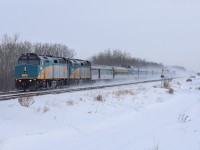 An 11 hour late VIA No. 1, The Candian blasts through Acheson kicking up the freshly fallen snow, on a brisk -25 degree day. 