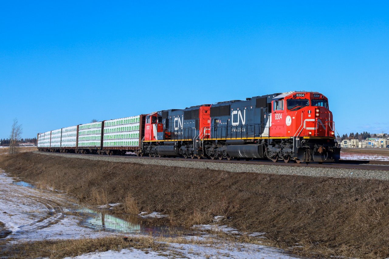 CN 8304 and CN 8302 roll through Spruce Grove with Prince George to Winnipeg manifest M 34851 26.