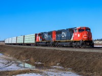 CN 8304 and CN 8302 roll through Spruce Grove with Prince George to Winnipeg manifest M 34851 26. 