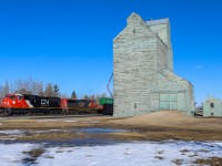 A 44251 04 rolls past the elevator at Camrose with SD75IACC 8301 leading. 