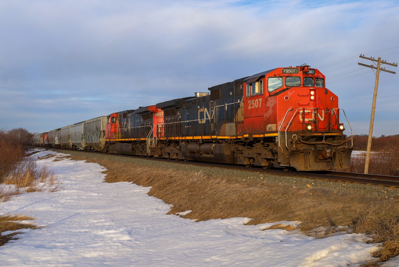 G 84851 03 climbs the grade towards Busby, Alberta with CN 2507 and CN 2509.