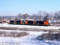 Some of Southern Ontario RaiLink's small fleet of switchers congregate in the SOR/CN Stuart Street yard awaiting their next assignments. Units shown are ex-CN SW1200RS 1367, 1359, 1201 (renumbered ex-CN 1335), and 1285. There were a few other switchers SOR owned, including <a href=http://www.railpictures.ca/?attachment_id=10971><b>1311</b></a> (derelict, scrapped 2001), <a href=http://www.railpictures.ca/?attachment_id=33197><b>1348</b></a> (bent frame, scrapped 2005), and the oddball <a href=http://www.railpictures.ca/?attachment_id=43795><b>ex-SW13B 1200</b></a> (scrapped 2008). 
<br><br>
1367 was transferred to an operation in the US in 2005, and 1201, 1285 & 1359 remained on the SOR, although by the mid-late 2000's most were out of service and stored (1359 was reactivated in 2008). All three remaining SW1200RS units were sold to LDS around 2010-2011, who overhauled them and sold them off.
<br><br>
<i>Bill McArthur photo, Dan Dell'Unto collection slide.</i>