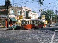 TTC PCC 4107 (A1 class, CC&F 1938) heads southbound on Dundas Street West stopped at Bloor Street West, operating on a King streetcar run heading for Church Street.<br><br>This view shows the northwest corner of Dundas and Bloor, featuring Al's Smokes & Gifts (try their Player's Mild), Bloor & Dundas Hardware (selling CIL Paints), a restaurant/billiards bar, and a pharmacy. The yellow building is a new Hertz Rent-a-Car shop (built where a house used to be) and beyond that is the new <a href=http://www.railpictures.ca/?attachment_id=51391><b>Dundas West Subway Station</b></a> building under construction, for the new crosstown Bloor-Danforth subway line (opened February next year). Where the station is used to be the St. Joan of Arc Church (SW corner of Dundas & Edna). It was demolished in early 60's the subway station, and moved to a new church at 1701 Bloor St. W.)<br><br>Compare this with a "Time Machine" photo from 1980: <a href=http://www.railpictures.ca/?attachment_id=53600>http://www.railpictures.ca/?attachment_id=53600</b></a>. The block at the northwest corner was boarded up in the late 2000's for a condo development that, a decade and a half later, still hasn't been built.<br><br><i>Barker Gummere photo, Dan Dell'Unto collection slide.</i>