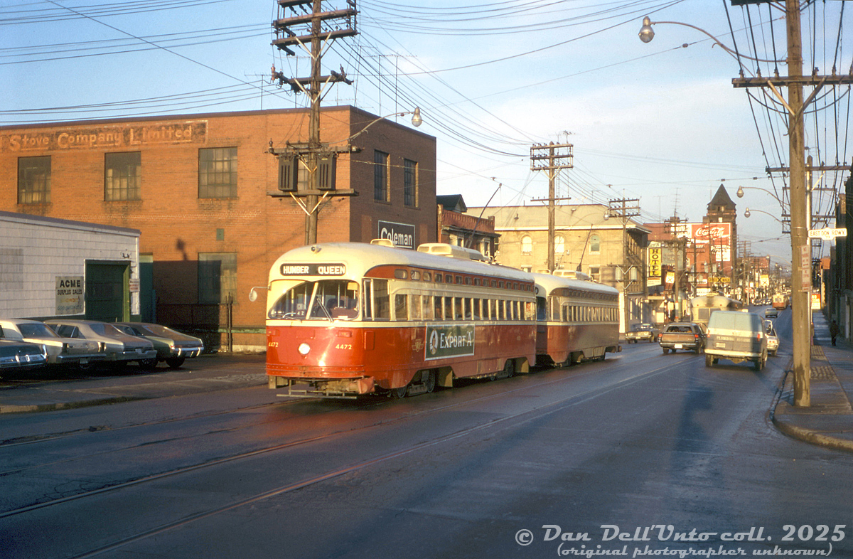 TTC PCC 4472 (A7-class, CC&F 1949) heads westbound on Queen Street East at the East Don Roadway (just east of the Don River bridge), MU'ed with another 4400-series in Queen service. They are both passing the old Coleman Lamp and Stove Company building (still there today, at 580 Queen St. E), and another building marked "Acme Surplus Sales".After streetcar service on Bloor and Danforth ended with the opening of the new subway, the 4400- and 4600-series streetcars retained their MU couplers and were redeployed on other busy streetcar routes, such as Queen.Original photographer unknown (possibly John H. Eagle), Dan Dell'Unto collection slide.