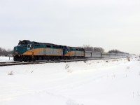 Scheduled to leave Edmonton just after midnight, VIA No. 1, the Canadian, makes a rare daylight appearance on the Edson sub running over 10 hours late. Twelve cars, including three domes, are a fine sight led by F40s 6455 and 6415.