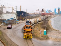 Reaching the bottom of the 2.83% grade, GEXR 581 crawls up to the Compass Minerals Salt Mine with 19 empties.  9 loads are waiting to be lifted momentarily, joining the rest of their 15 car train for Stratford.